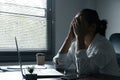 A woman battles depression and stress in her workplace, highlighting the challenges faced by professionals. This image captures