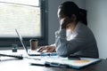 A woman battles depression and stress in her workplace, highlighting the challenges faced by professionals. This image captures