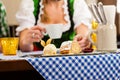 woman in Bavarian Tracht in restaurant or pub