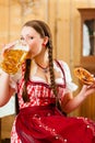 woman in Bavarian Tracht in restaurant or pub