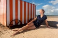 Woman beach cabin sea, De Panne, Belgium Royalty Free Stock Photo