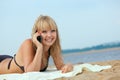 Woman on beach calling by cell phonr Royalty Free Stock Photo