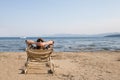 Woman in Beach Chair Looking Away at Horizon Royalty Free Stock Photo