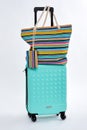 Woman beach handbag, modern suitcase.