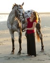 Woman on the beach with horse Royalty Free Stock Photo