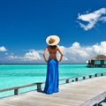 Woman on a beach jetty at Maldives Royalty Free Stock Photo