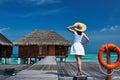 Woman on a beach jetty at Maldives Royalty Free Stock Photo