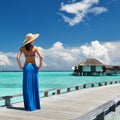 Woman on a beach jetty at Maldives Royalty Free Stock Photo