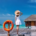 Woman on a beach jetty at Maldives Royalty Free Stock Photo