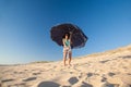 Woman at beach with open parasol Royalty Free Stock Photo