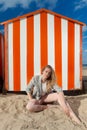 Woman beach sun sand hut, De Panne, Belgium