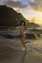 Woman on beach at sunrise Royalty Free Stock Photo