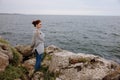 woman beach tourism cloudy weather stone coast Lifestyle Royalty Free Stock Photo