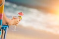 Woman on Beach with Tropical Drink