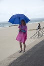 Woman on beach under an umbrella Royalty Free Stock Photo