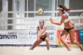 Woman beach volleyball player. Defense