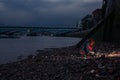 Woman beachcombing in city at night Royalty Free Stock Photo