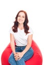 Woman on bean bag chair Royalty Free Stock Photo