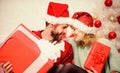 Woman and bearded man wear santa claus hat christmas tree background. Christmas eve with darling. Family married couple