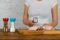 Woman beats chicken with a hammer Royalty Free Stock Photo