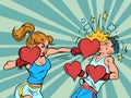 A woman beats a man. Female boxer valentine's day heart gloves, strong emotions feelings