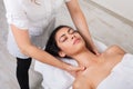 Woman beautician doctor make body massage in spa wellness center