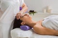 Woman beautician doctor make head massage in spa wellness center Royalty Free Stock Photo