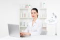 Woman beautician doctor at work in spa center. Portrait of a young female professional cosmetologist. Female employee in Royalty Free Stock Photo