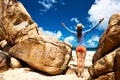 Woman at beautiful beach wearing rash guard