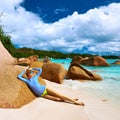 Woman at beautiful beach wearing rash guard