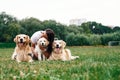 Woman with beautiful dogs are in the field outdoors