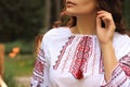Woman in beautiful embroidered shirt, closeup. Ukrainian national clothes