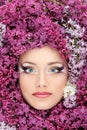 Woman beautiful face with flower lilac border
