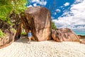 Woman at beautiful Seychelles beach wearing rash guard