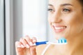Woman With Beautiful Smile, Healthy White Teeth With Toothbrush. Royalty Free Stock Photo