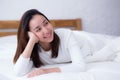 Woman beautiful smiling woman portrait wake up early morning after sleeping and lying in bed Royalty Free Stock Photo