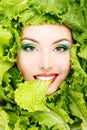 Woman Beauty Face With Green Fresh Lettuce Leaves