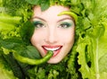 Woman beauty face with greens vegetables and pepper frame Royalty Free Stock Photo