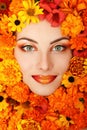 Woman beauty face with orange flowers