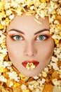 Woman beauty face with unhealth eating fast food popcorn potato Royalty Free Stock Photo