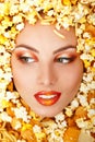 Woman beauty face with unhealth eating fast food popcorn potato Royalty Free Stock Photo