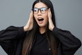 Pointing woman business background studio fashion cute beautiful asian student portrait glasses smile finger Royalty Free Stock Photo