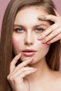 Woman Beauty Portrait, Model Touching perfect Face Skin, Beautiful Girl Makeup and Nails Care, Looking through Fingers Royalty Free Stock Photo