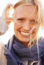 Woman, beauty and portrait with smile in sunshine, outdoor or spring fashion or happiness. Closeup, wind and natural