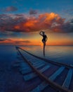 Woman at beauty sunset on salty lake Royalty Free Stock Photo