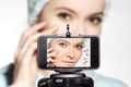 Woman Beauty Vlogger. Video by Smartphone Sharing on Social Media. Fashion Blogger show Daily Morning Face Care Routine Royalty Free Stock Photo
