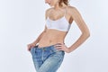 Woman became skinny and wearing old jeans Royalty Free Stock Photo