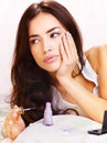 Woman in bed applying nail polish Royalty Free Stock Photo