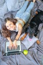 Woman in bed with big dog Royalty Free Stock Photo