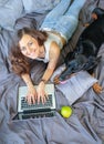 Woman in bed with big dog Royalty Free Stock Photo